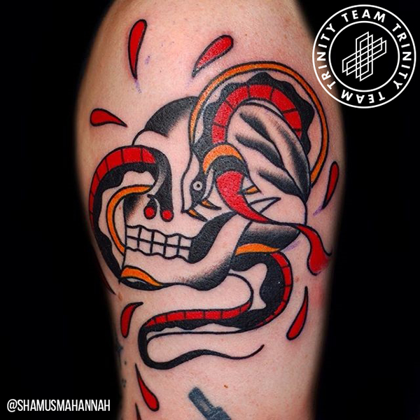 snake coming out of the eye of a skull tattoo